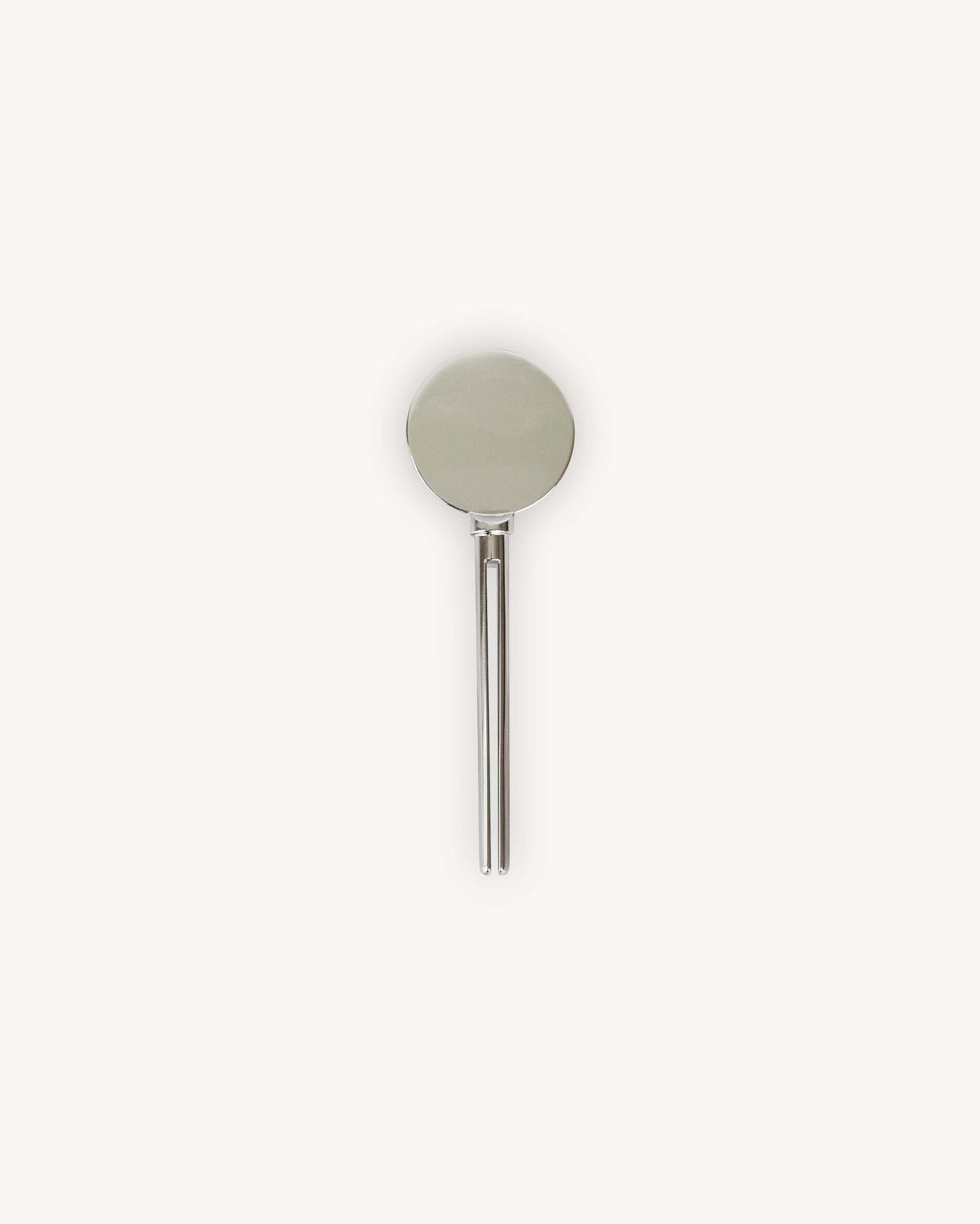 A minimalist zinc alloy METAL tube key featuring a circular disc head and a slim vertical prong pin design to slip aluminum tube into.